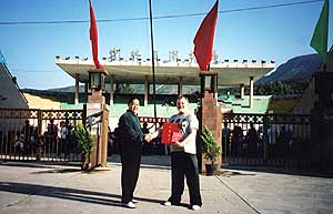 Allan receiving certification from Master Feng